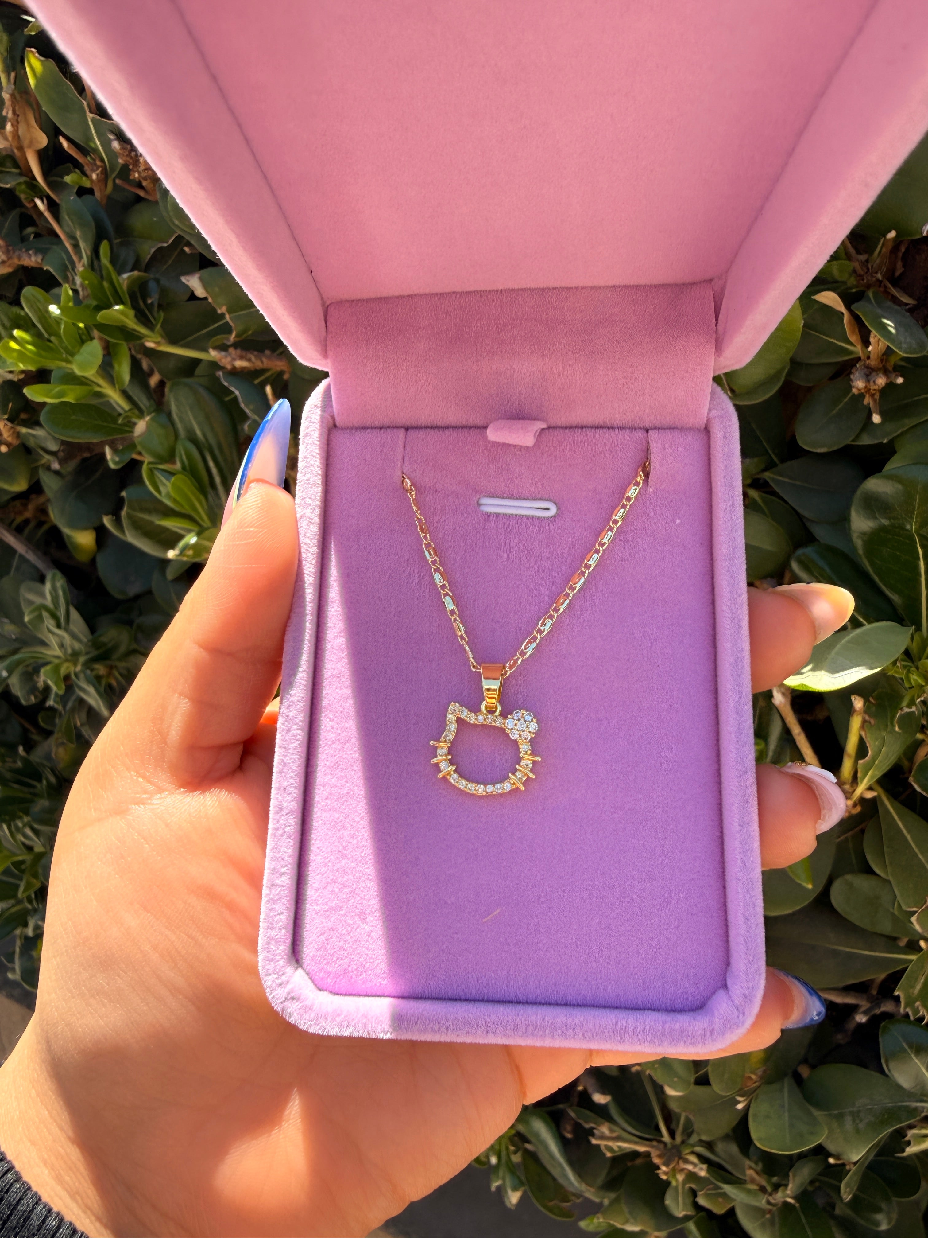 Hk outline face necklace
